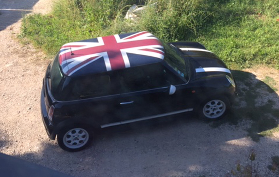 Mini Cooper semi-covering English flag roof